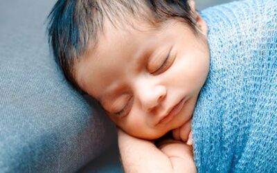 Newborn baby holding US passport ESTA infant traveler