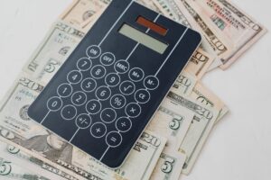 ESTA US travel — calculator dollar bills travel budget 1