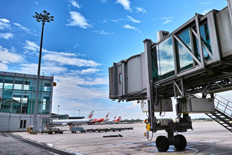 Jet bridge connecting an aircraft at a busy airport