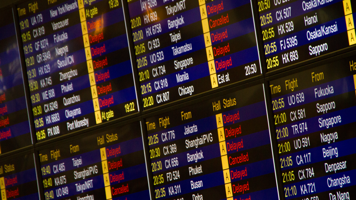 Departure board showing a connecting flight through the US