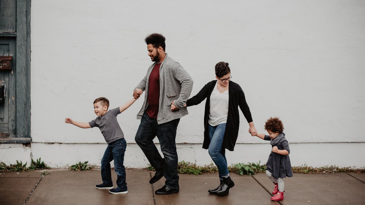 Parents and children heading to a US flight