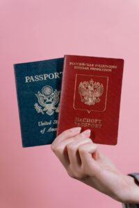 Passport open to the data page next to an ESTA approval printout