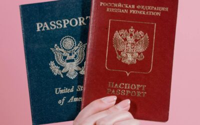 Passport open to the data page next to an ESTA approval printout