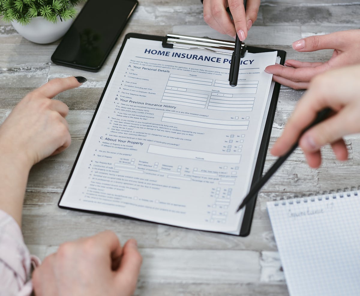 Comparison of travel insurance policy documents on a desk