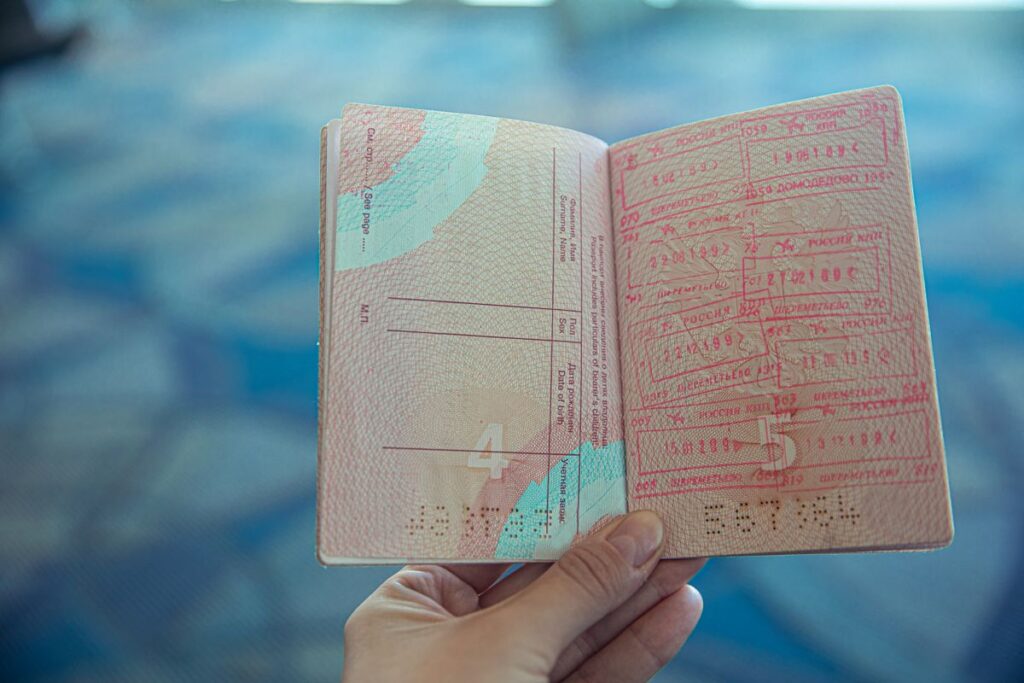 Passport with multiple US entry stamps representing ESTA multiple entries