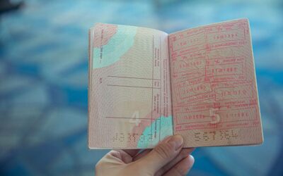 US border officer reviewing a passport, where your ESTA I-94 record is created on arrival