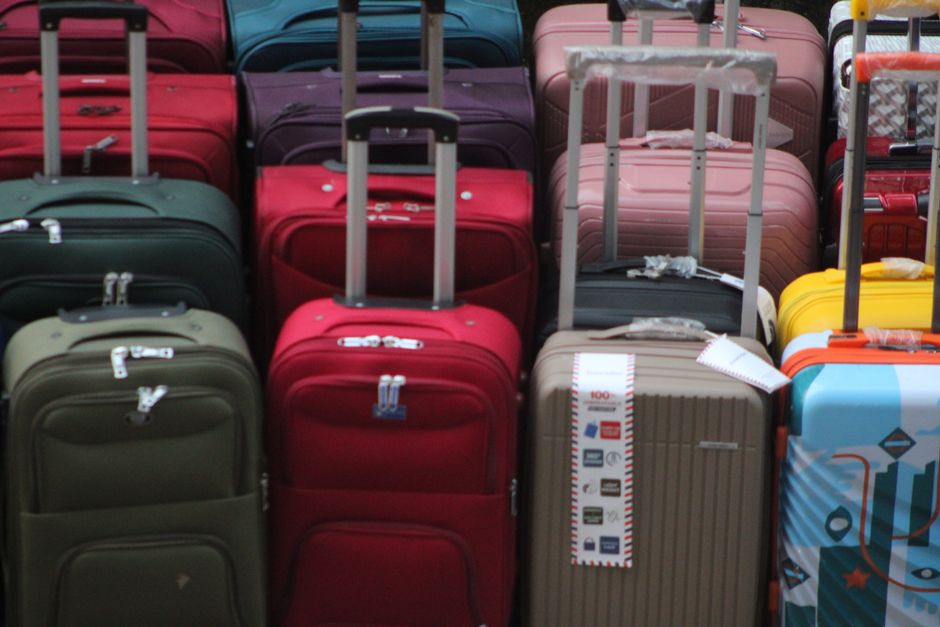 Traveler packing medicines in hand luggage before bringing medication into the USA
