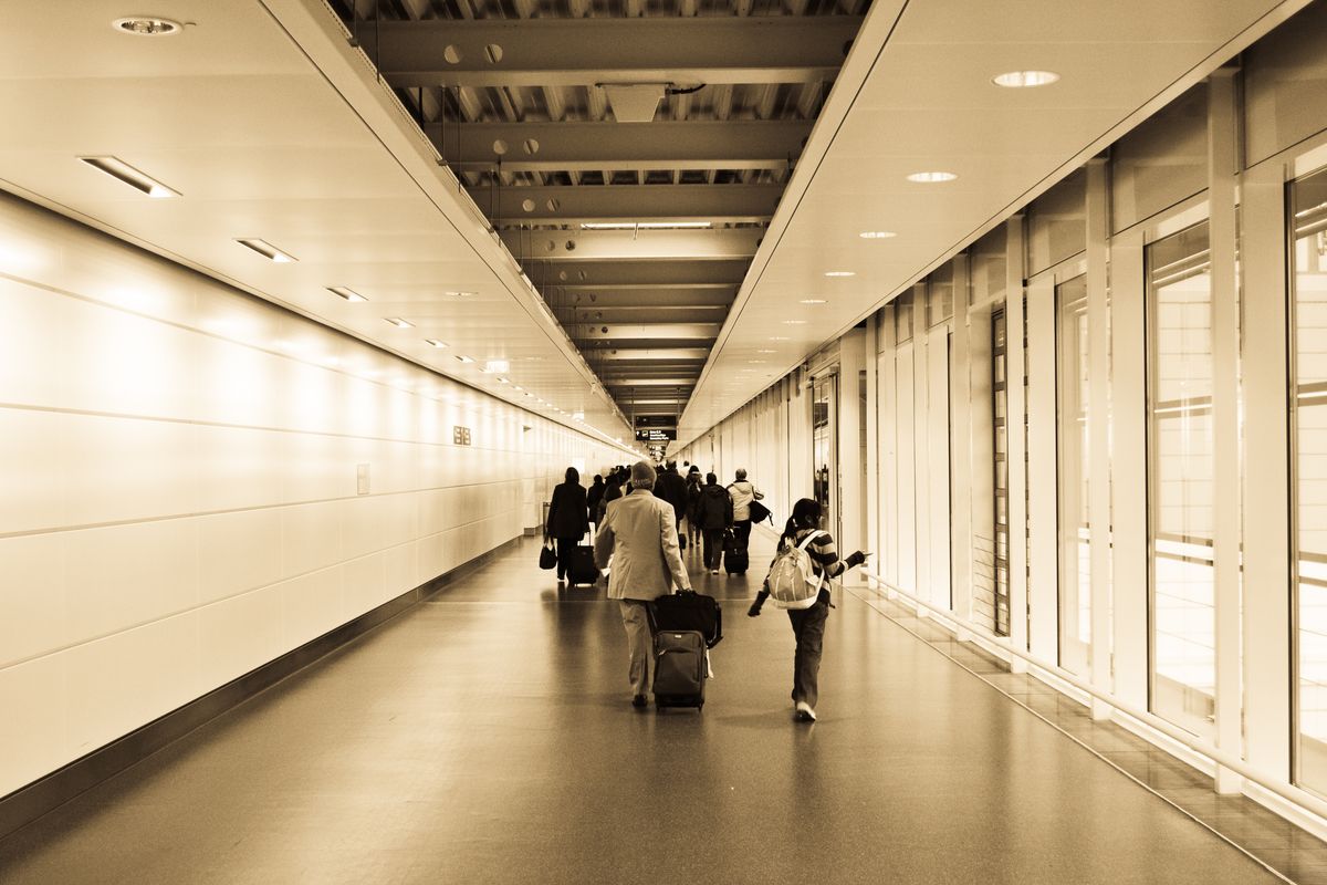 Business traveler and tourist checking ESTA eligibility on a phone