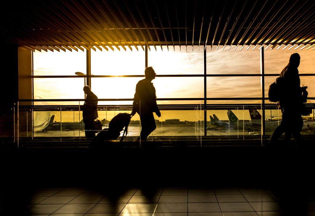 Diverse group of international travelers with passports at a US airport