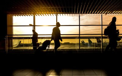 Diverse group of international travelers with passports at a US airport