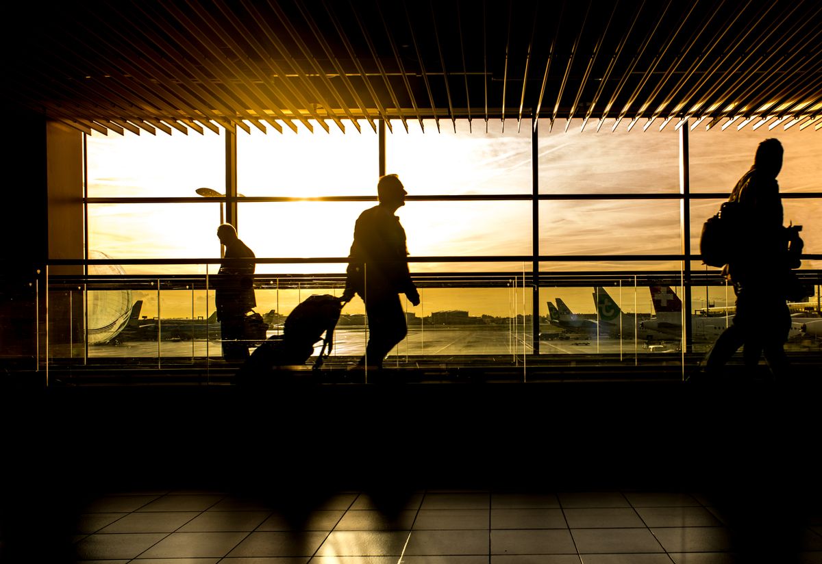 Diverse group of international travelers with passports at a US airport