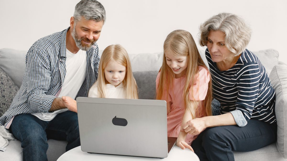 Parents completing ESTA application online for children
