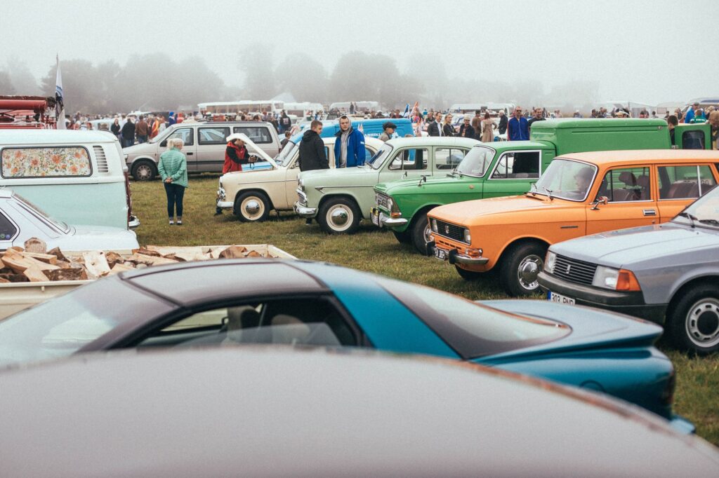 Classic cars lined up at a Route 66 centennial festival car show in 2026
