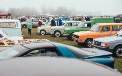 Classic cars lined up at a Route 66 centennial festival car show in 2026
