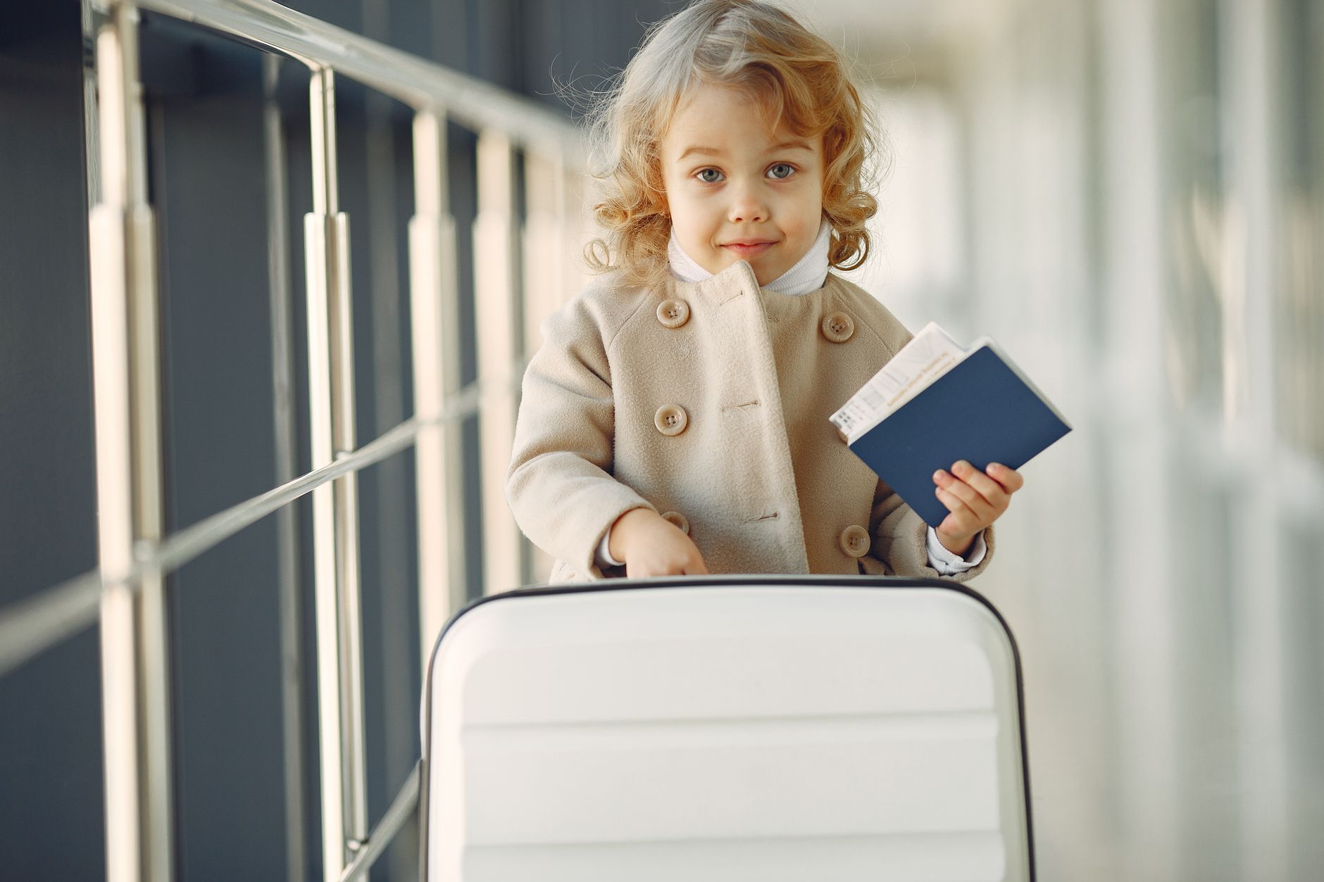 Young child traveller at a US airport with family ESTA documents