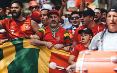 Football fans waving national flags and celebrating at the World Cup 2026 final