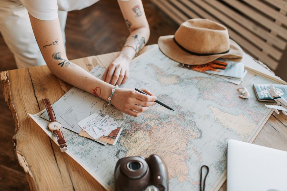 Passport, boarding pass and phone laid out while planning when to apply for an ESTA