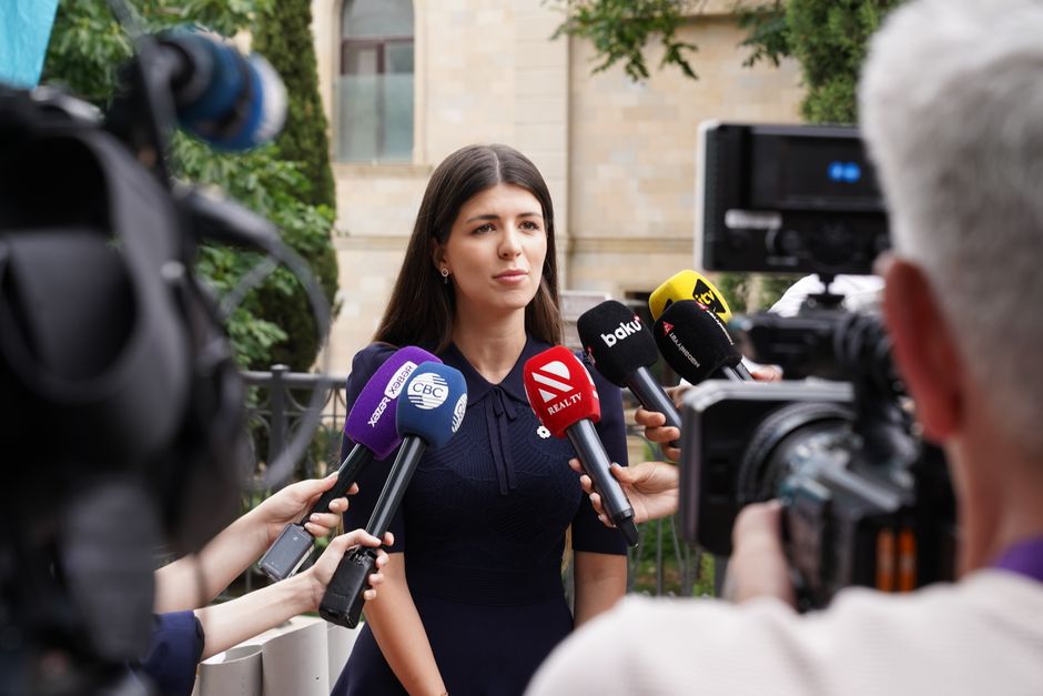 ESTA for journalists explained with a press photographer holding a camera at a US arrival gate