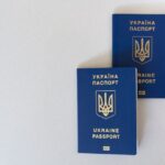 Two passports on a desk illustrating whether you can hold two US ESTAs at once