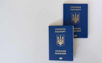 Two passports on a desk illustrating whether you can hold two US ESTAs at once