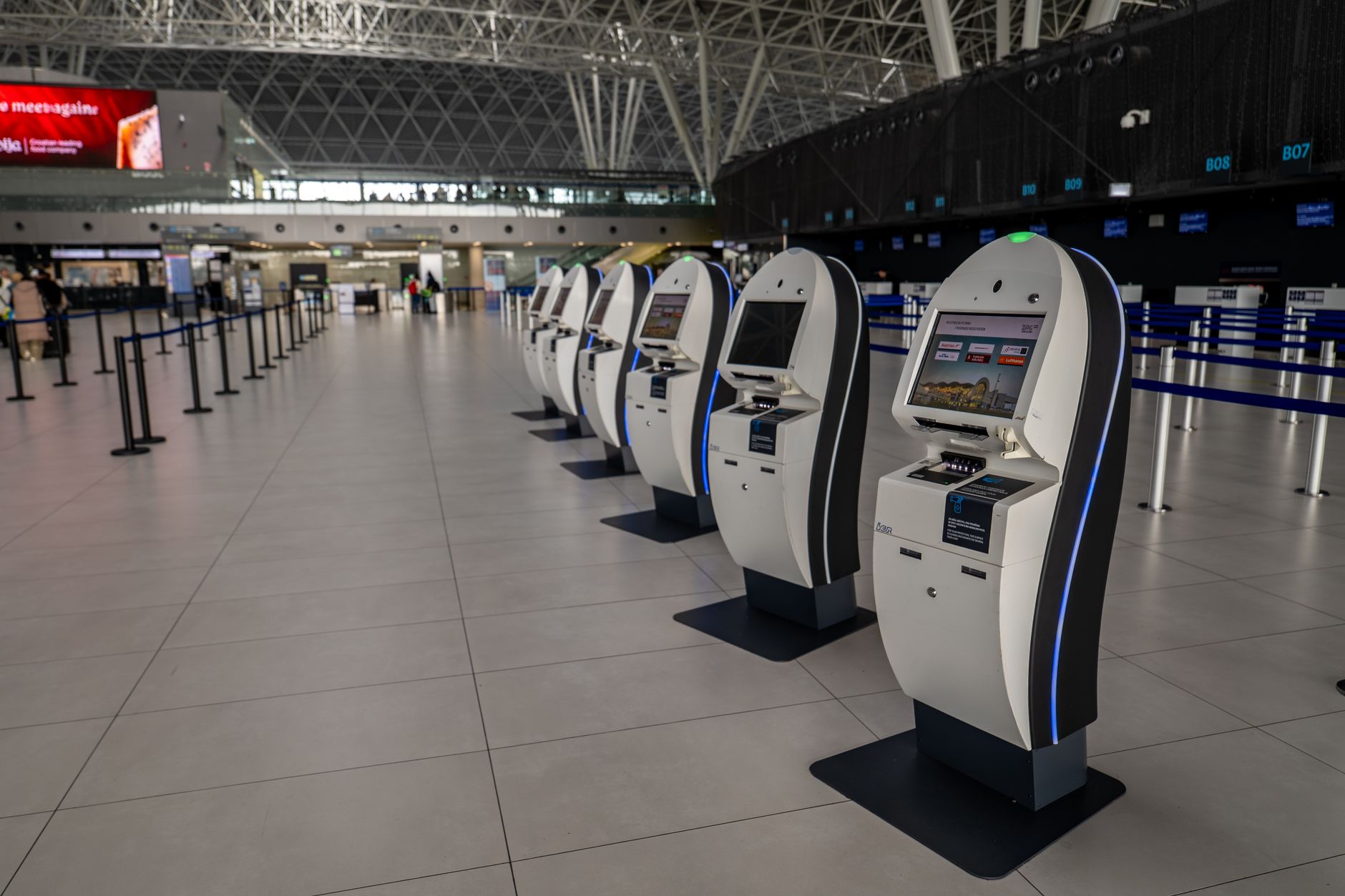 A traveler using a self-service trusted traveler kiosk at a US airport