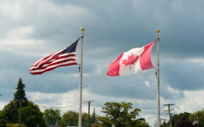 Canadian and American flags side by side symbolizing US entry rules for Canadians