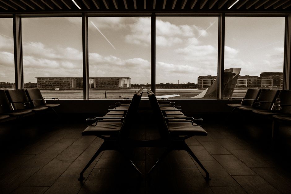 Quiet US airport terminal at night where travellers consider sleeping at US airports on a layover