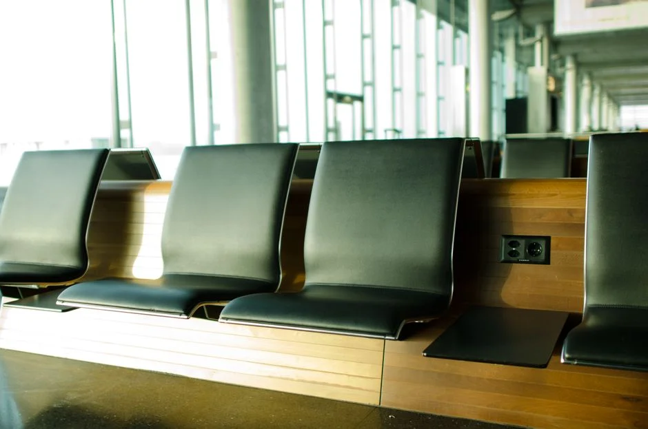 Airport lounge with reclining chairs for resting during a long US layover