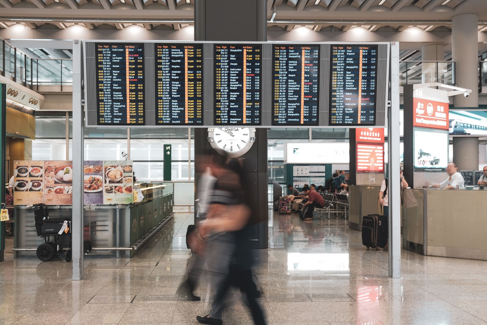 Traveler checking the clock before the ESTA application deadline at the airport
