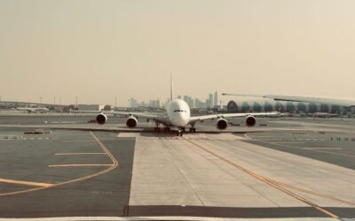 Emirati traveler at the airport reviewing US ESTA and visa options in 2026